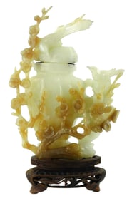 ASIAN: Flat covered hardstone vase with carved birds and prunus, Chinese, 20th C., variegated stone