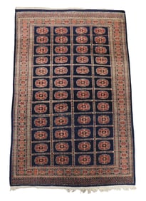 RUG: Modern Tekke Bokhara rug, 6' 2" l. x 3' 10" w., dark blue field, four rows of twelve guls in