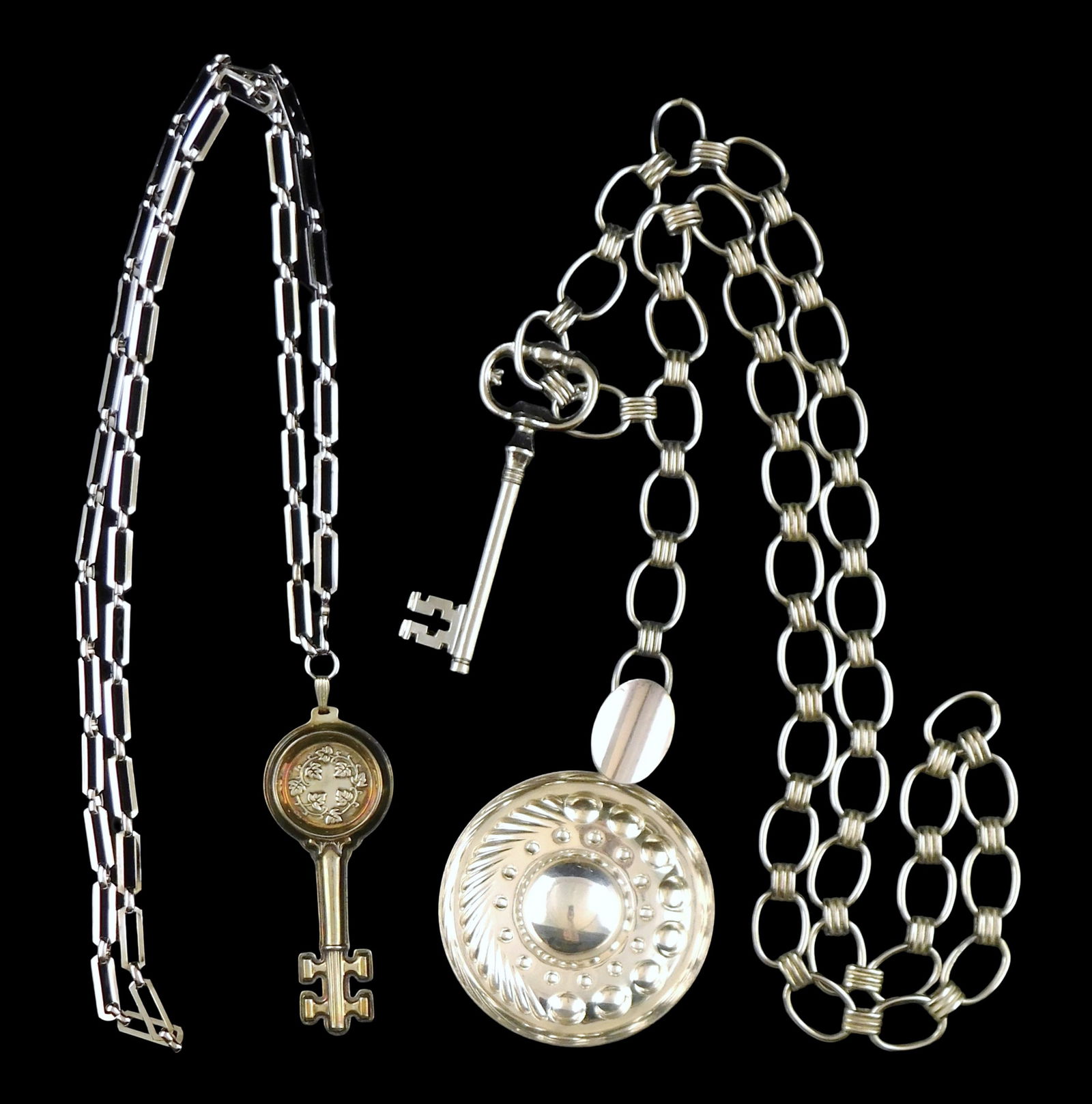 Reed & Barton, Christofle, two wine taster keys on chains, Reed & Barton sommelier’s key, sterling: Reed & Barton, Christofle, two wine taster keys on chains, Reed & Barton sommelier’s key, sterling silver key on 39” rhodium plated chain, etching to back of key, informational card included;