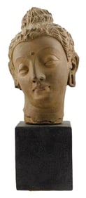 ASIAN: Alva Museum Reproduction Buddhist sculpture, ceramic head "fragment" mounted on block, signed