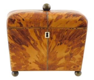 Tea caddy with blonde tortoise shell veneer exterior, 19th C., tapered body rests on ball feet, dome