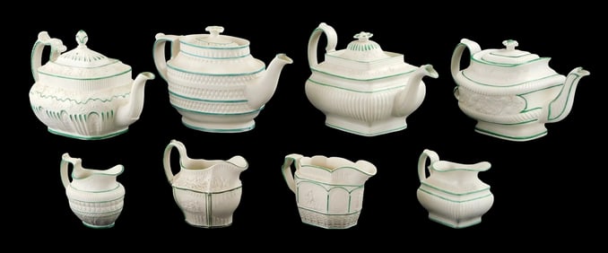 Castleford-type creamware with green glaze trim, 19th C., includes four creamer pitchers and four te