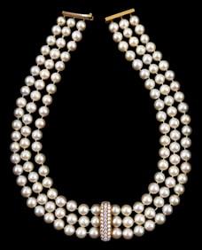 JEWELRY: Triple strand cultured pearl necklace with 18K diamond separator, each strand contains