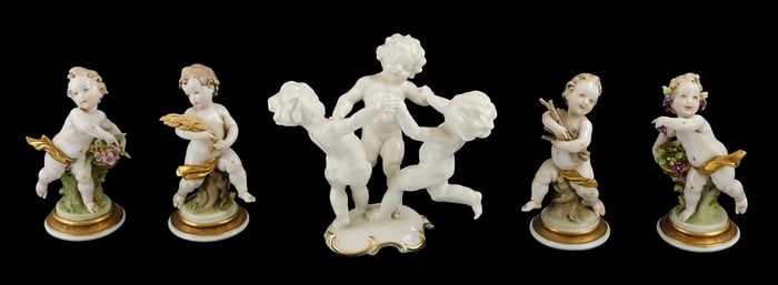 Five porcelain putti figurines, details include: Karl Tutter for Hutschenreuther, figurine of three