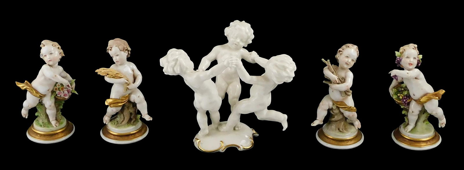 Five porcelain putti figurines, details include: Karl Tutter for Hutschenreuther, figurine of three  (1 of 7)