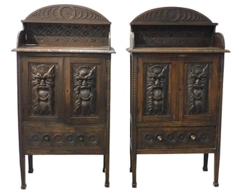 Pair Renaissance Revival cabinets with masque carved doors over single drawer, 19th C., open shelf