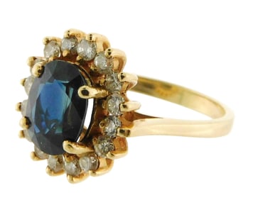 JEWELRY: 14K Sapphire and diamond ring, setting stamped and tested "14K" yellow gold halo style