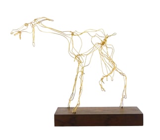 Mid-20th C. modernist wire sculpture of goat, constructed out of bent brass-toned wire, it has long