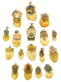 JEWELRY: Gold Elks BPOE charms/pendants, sixteen pendants along with a Masonic locket, all tested