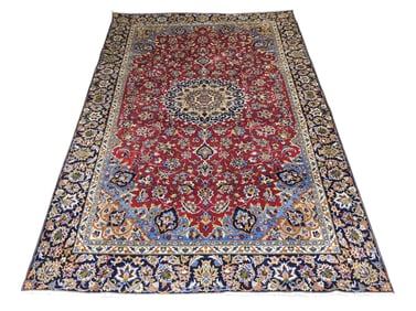 RUG: Antique Kashan carpet, 8' x 11', c. 1940's, wool on cotton, red ground, dark blue border,