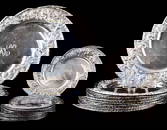 STERLING: S. Kirk & Son sterling silver service and butter plates with floral repousse rims,