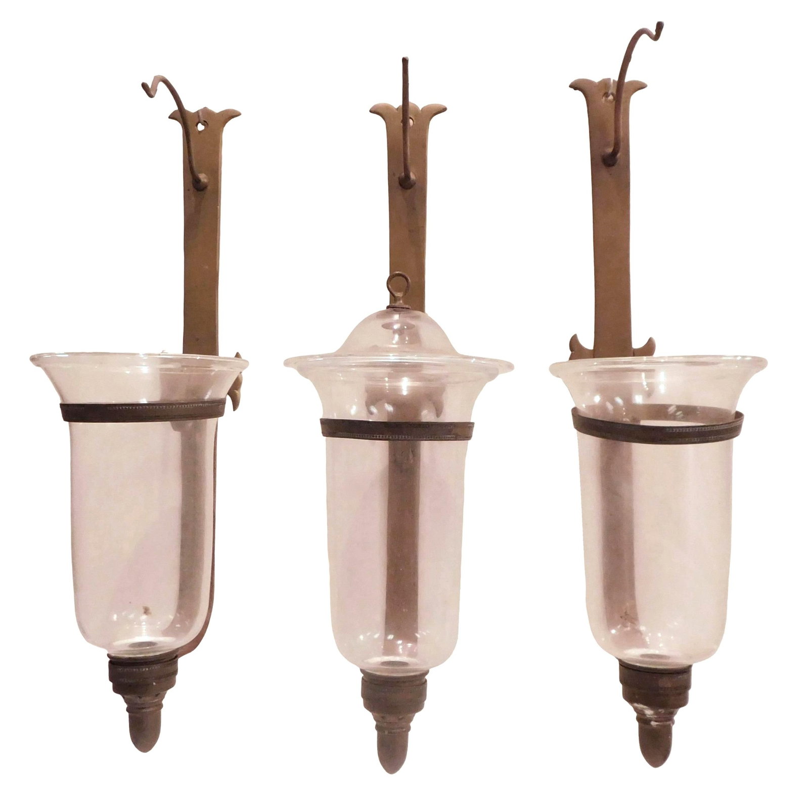 Three English brass and glass hurricane wall mounted sconces, Regency/ Georgian style, brass support: Three English brass and glass hurricane wall mounted sconces, Regency/ Georgian style, brass support with whale tail crest and flanking arms, two brass support rings with beaded border and arched smok