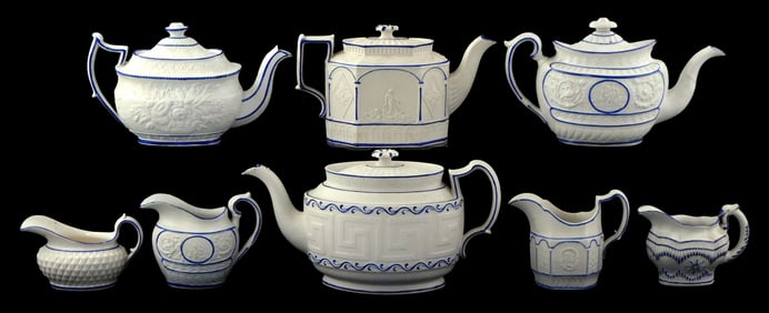 Castleford-type creamware with blue glaze trim, 19th C., eight pieces including: four creamer
