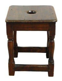 Joint stool, Continental, 18th C., walnut, rounded edge top with center hole over apron with molded