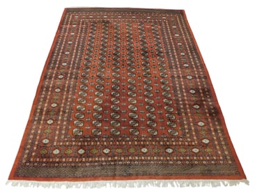 RUG: Modern Bokhara tekke design rug, 13' 6" l. x 10' 6" w., finely woven, red with accents of rust,