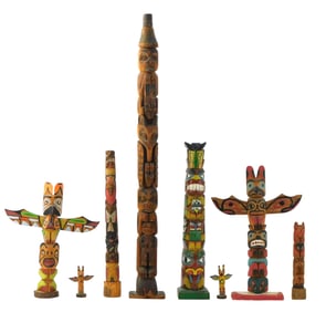 +TRIBAL: Eight totem pole sculptures, all carved wood with polychrome painted details, likely