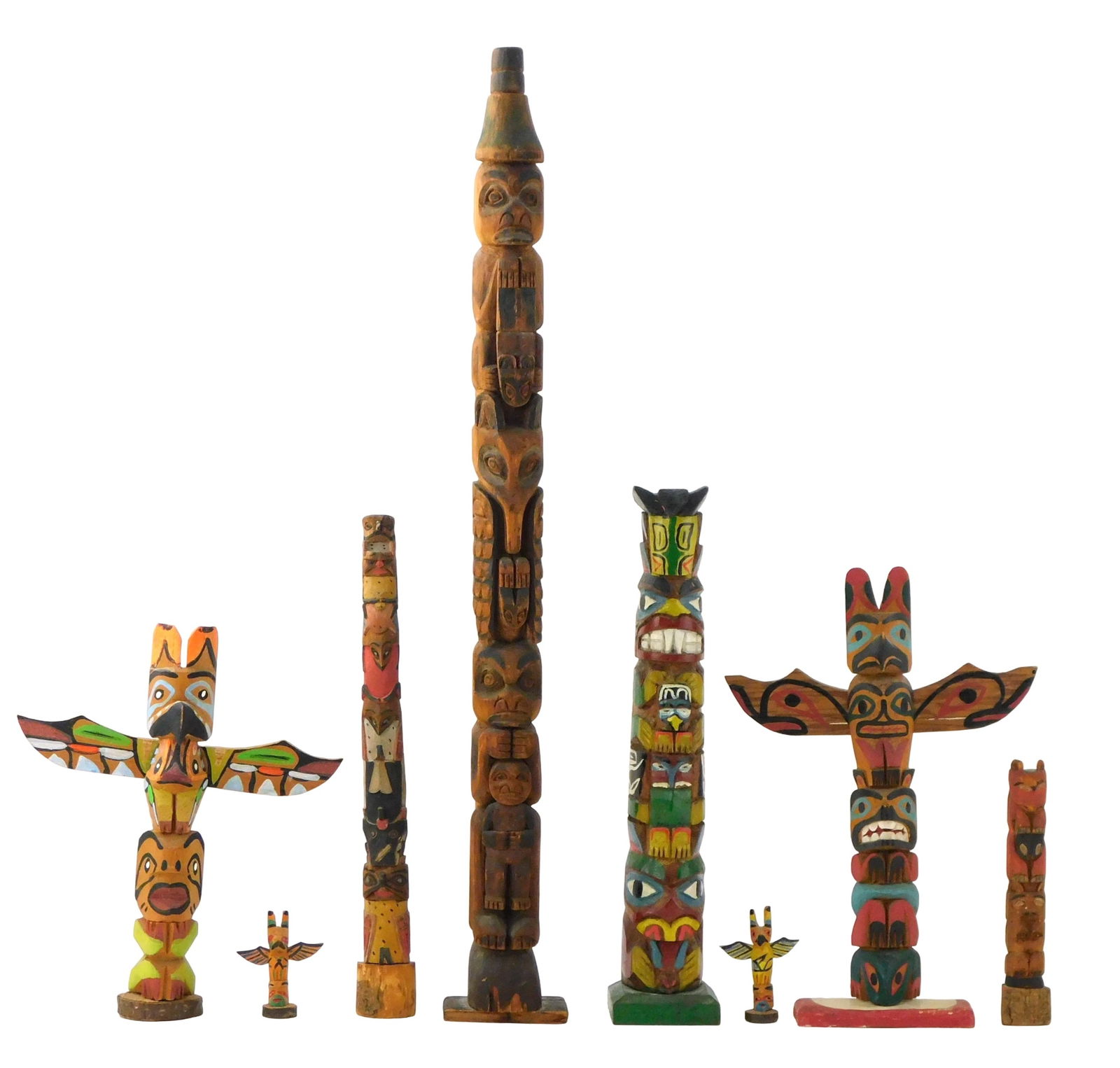 +TRIBAL: Eight totem pole sculptures, all carved wood with polychrome painted details, likely (1 of 8)