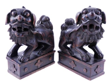 ASIAN: Pair of carved wood Buddhistic lions (foo dogs), Chinese, probably Qing Dynasty, modeled