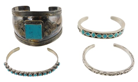 JEWELRY: Four Southwest style silver cuff bracelets, including one thicker bangle stamped "925" and