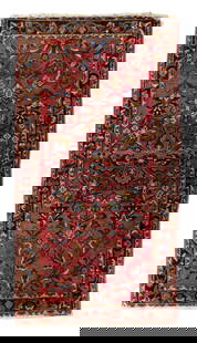 RUG: Antique Persian painted Sarouk style rug, 4' 8" x 2' 7", wool on cotton, a deep red field,: RUG: Antique Persian painted Sarouk style rug, 4' 8" x 2' 7", wool on cotton, a deep red field, accents of olive green, navy, brown and medium blue, black primary border, wear consistent with age and