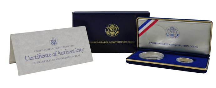 COINS: 1987 Two coin US Constitution commemorative set in box. Proof $1 silver and $5 gold coins.