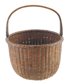 Nantucket type basket with swing handle, late 19th/ early 20th C., round form with open top, turned
