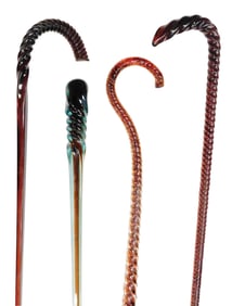 ART GLASS/ WHIMSEYS: Lot of four amber free-blown glass walking sticks/canes, including: solid light