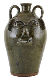 FACE JUG: Monumental Burlon Craig (Vale, N.C.,1914–2002) folk art pottery jug, mottled olive