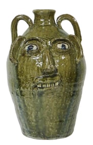 FACE JUG: Burlon Craig (Vale, N.C.,1914–2002) large folk art pottery jug, mottled olive green