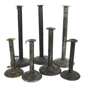 Seven tin hog scraper candlesticks, American, 19th C., each with push-up mechanism and four with