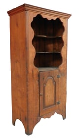 Floor cupboard, American, 18th C., pine, molded flat top over scalloped opening, open interior with