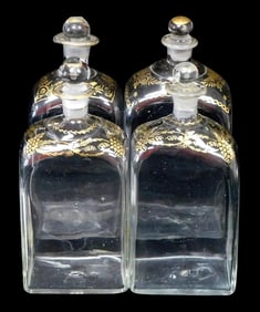 GLASS: Set of four blown gilt case decanters, mid/late 19th C., possibly French or Dutch, all with