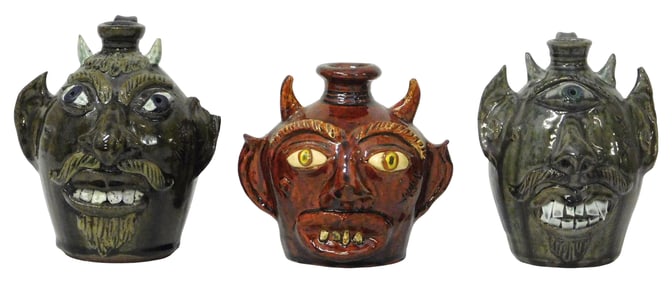FACE JUGS: Three Albert Hodge (Vale, N.C., b. 1941) folk art pottery grotesque face jugs, all devil