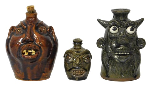 FACE JUGS: Michel Bayne, Louis Brown, etc., three signed pottery jugs, details include: smallest by
