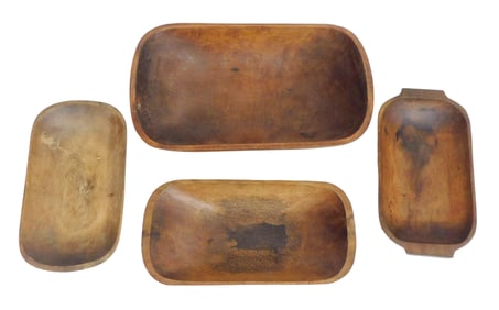 TREENWARE: 19th/20th C., four oblong trenchers, one with flanking carved handles, wear consistent