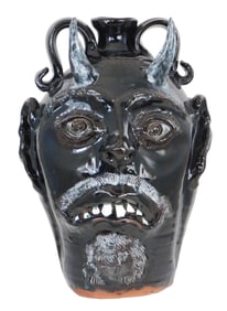 FACE JUG: Bobby Ferguson (Georgia, 1933 - 2005), "Black Devil Face", 2000, folk art pottery jug,