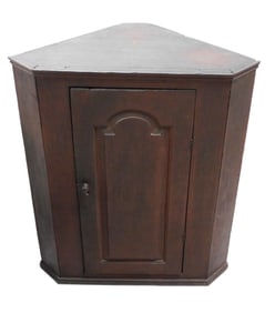 Low floor corner cupboard, likely Pennsylvania, 18th C., walnut and pine, top molded over door with