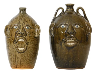FACE JUGS: Joe Reinhardt (North Carolina, 20th/ 21st C.), two folk art glazed pottery jugs,