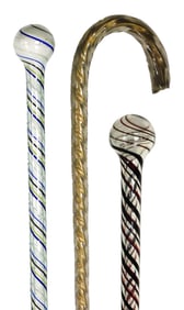 ART GLASS/ WHIMSEYS: Three free-blown glass canes/parade staffs, including: hollow blown cane with a