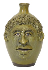 FACE JUG: Sandy Cole (North Carolina, late 20th/ 21st C.), "Green Face with Gray Eyes and Cleft