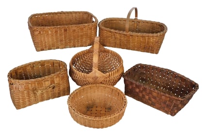 Six assorted splint baskets, 20th/21st. C., two shallow oblong, one oval with rope ornament on