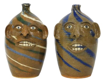 FACE JUGS: Joe Reinhardt (North Carolina, 20th/ 21st C.), two folk art glazed pottery jugs, both