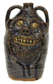 FACE JUG: Marie Rogers (Georgia, b. 1922), folk art grotesque pottery jug, double-face, tobacco-spit