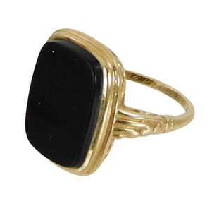 JEWELRY: 14K onyx ring, setting stamped and tested “14K” yellow gold, bezel setting with one