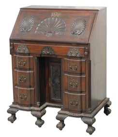 Kneehole blockfront slant lid desk, American, late 19th C., mahogany and mixed woods, slant lid with
