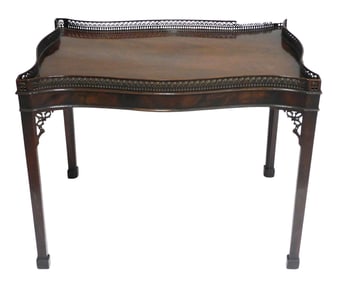 Fretwork tea table, English, 18th C., crotch mahogany, veneered serpentine edge top, complex pierced