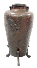 ASIAN: Japanese bronze vase on three scrolled supports (one loose), urn form with dragon relief,