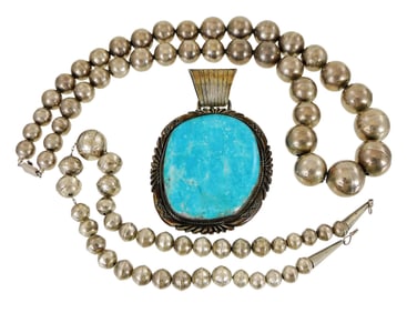 JEWELRY: Three bold silver pieces, including a large turquoise and sterling pendant, by Navajo