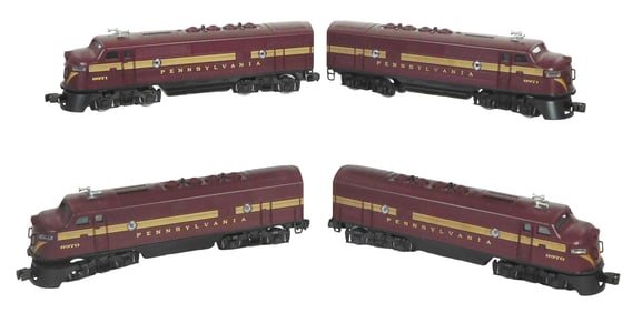 Four Lionel trains, all "Pennsylvania", two numbered "8971" and two numbered "8970", wear consistent
