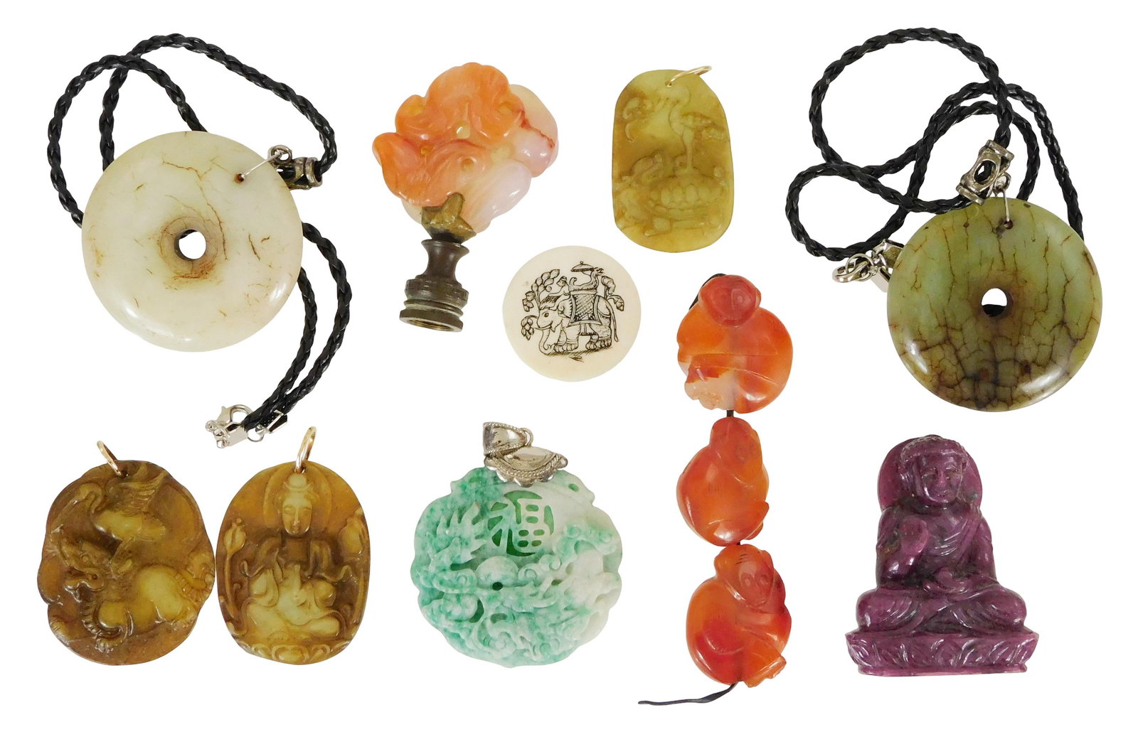 ASIAN: Twelve pieces of carved hardstone including a small Buddha sculpture in ruby; two jade type: ASIAN: Twelve pieces of carved hardstone including a small Buddha sculpture in ruby; two jade type bi-discs with silver findings; four carved pendants in serpentine or jade type; three carved monkey b